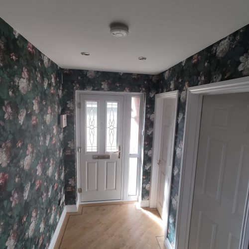 Wallpapered hall and stairs