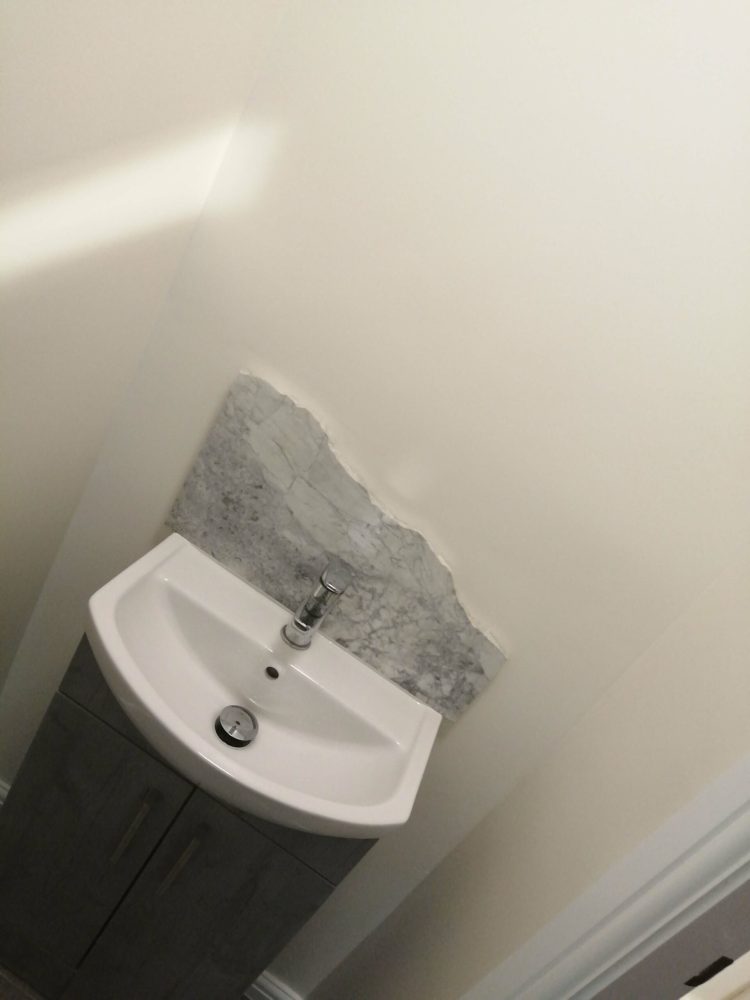 Cloakroom stone splashback